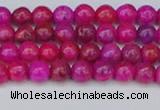 CAG9924 15.5 inches 4mm round fuchsia crazy lace agate beads