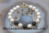 CFB1057 Hand-knotted 9mm - 10mm potato white freshwater pearl & black obsidian bracelet