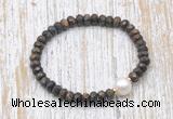 CFB754 faceted rondelle bronzite & potato white freshwater pearl stretchy bracelet