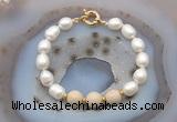 CFB946 Hand-knotted 9mm - 10mm rice white freshwater pearl & white fossil jasper bracelet