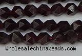 CNG7275 15.5 inches 6mm faceted nuggets red garnet beads