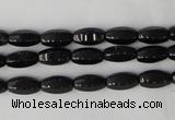 CTO116 15.5 inches 5*10mm faceted rice black tourmaline beads